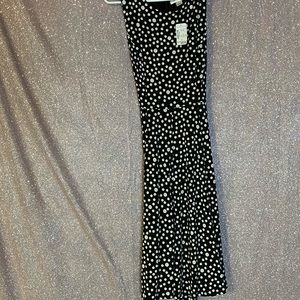 Sleeveless black and white polka dot dress
